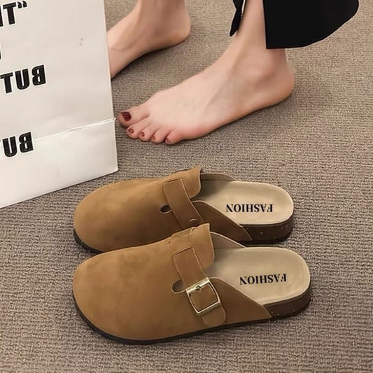 Half a slipper and one foot on lazy trendy shoes
