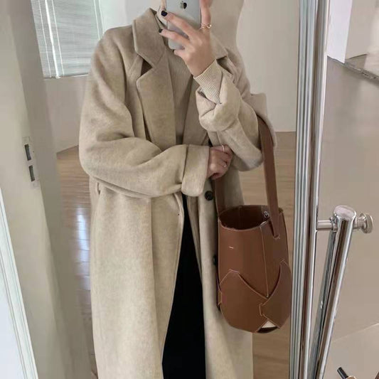 A loose and thick woolen coat for a short person