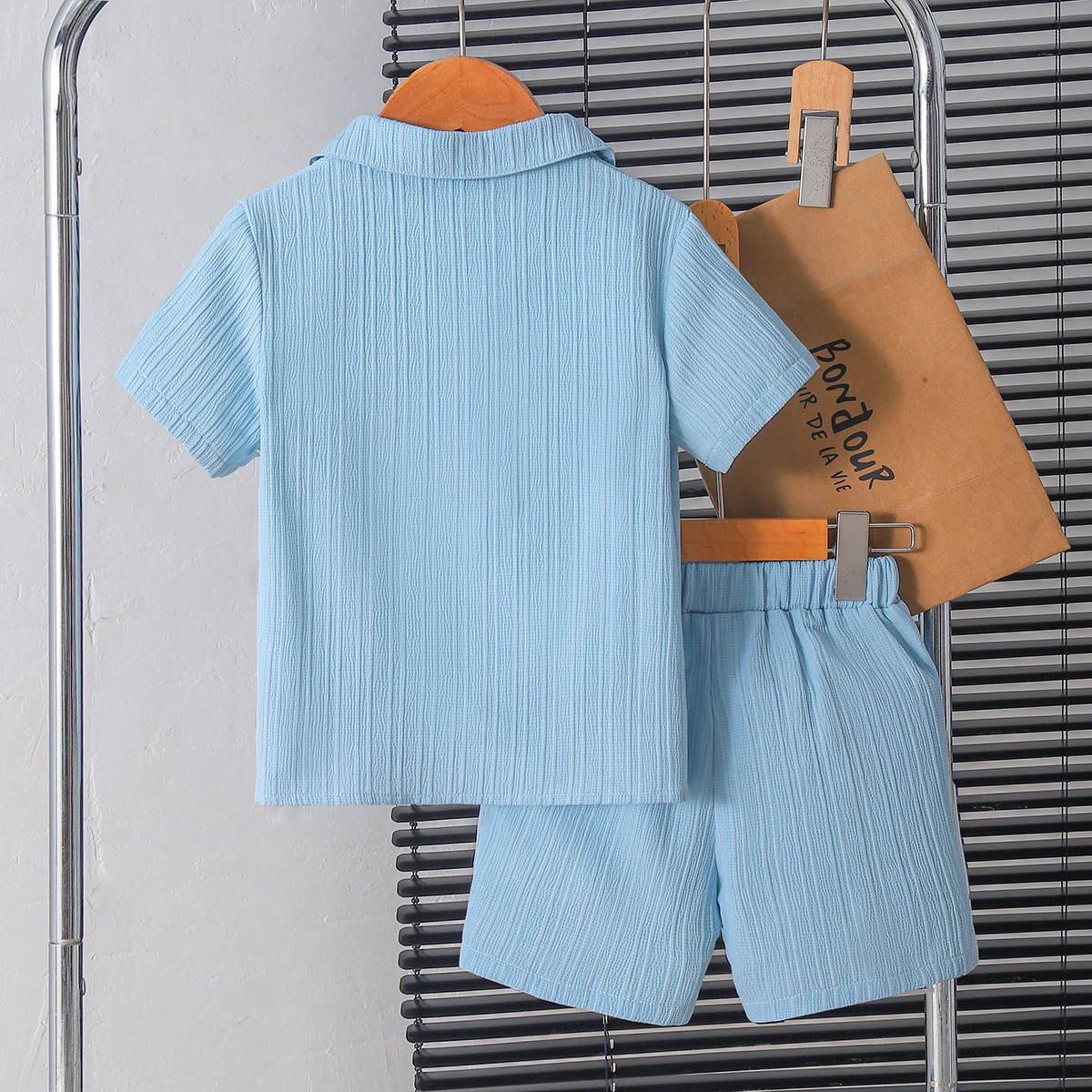 Boy's stylish gentleman's summer outfit in college style
